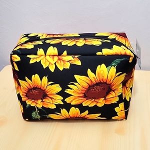 Canvas Sun flowers make up bag. Black background.